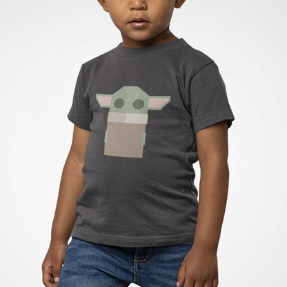 Moxie•Pop's youth graphic tee with a stylized geometric Grogu design in dark grey heather modeled by a boy with a white background