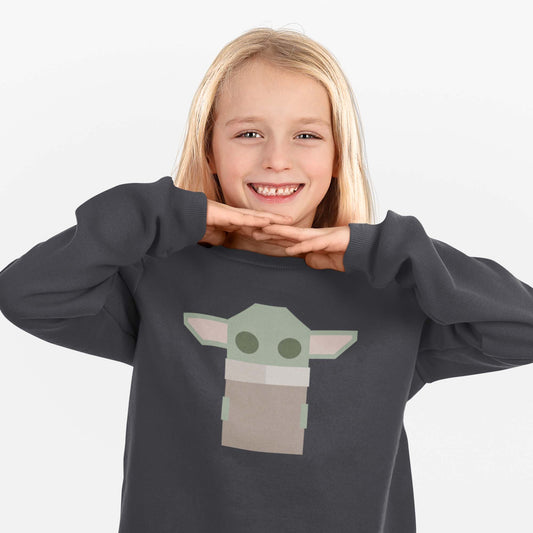 Moxie•Pop's youth graphic sweatshirt with a stylized geometric Grogu design in dark heather model by a girl with long blonde hair with a white background