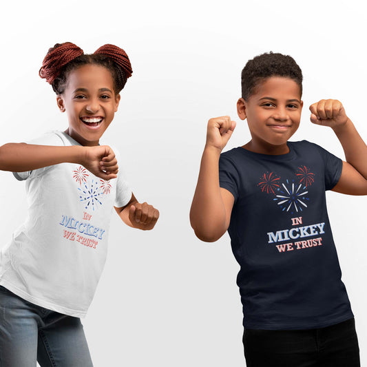 Moxie•Pop's unisex youth graphic tee with hand-drawn fireworks in the shape of Mickey Mouse silhouette with the phrase "In Mickey We Trust" in navy and white modeled by a girl and a boy with a white background