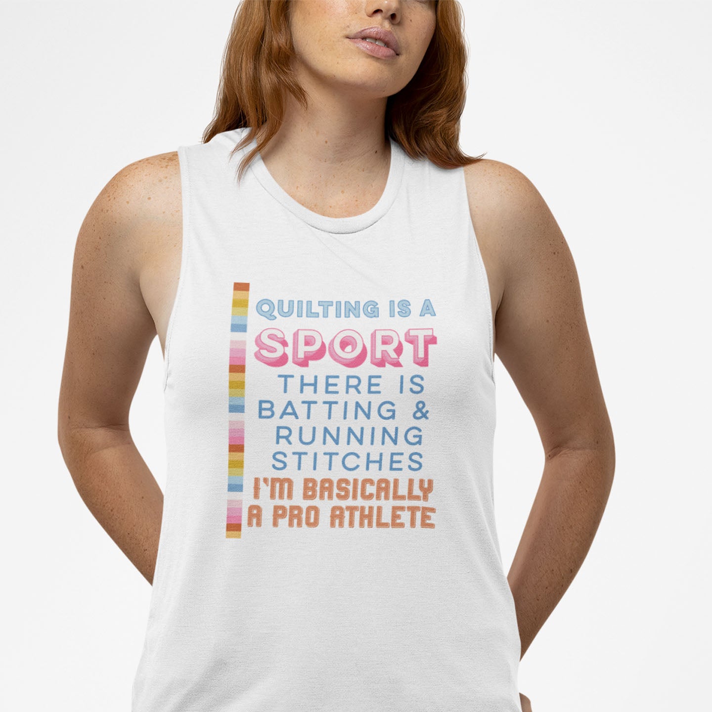 Moxie•Pop's women's muscle tank in white with "Quilting is a sport. There's batting and running stitches. I'm basically a pro athlete" graphic