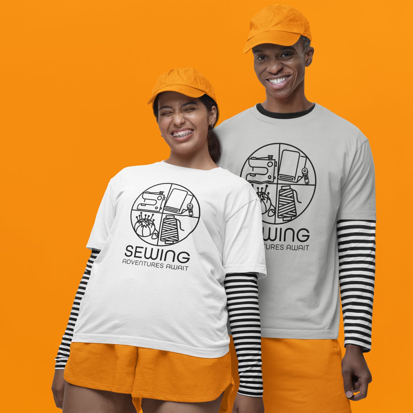 Modeled product image Moxie•Pop's unisex graphic tee with a black circle outline in four quadrants each with a sewing tool icon above 'Sewing Adventures Await' in athletic heather and white. Models are wearing orange hats and shorts, striped long sleeve tees beneath the graphic tees, with a orange backdrop.