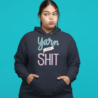 Modeled product image of Moxie•Pop's unisex graphic hoodie with hand lettered "Yarn and Shit" design in navy