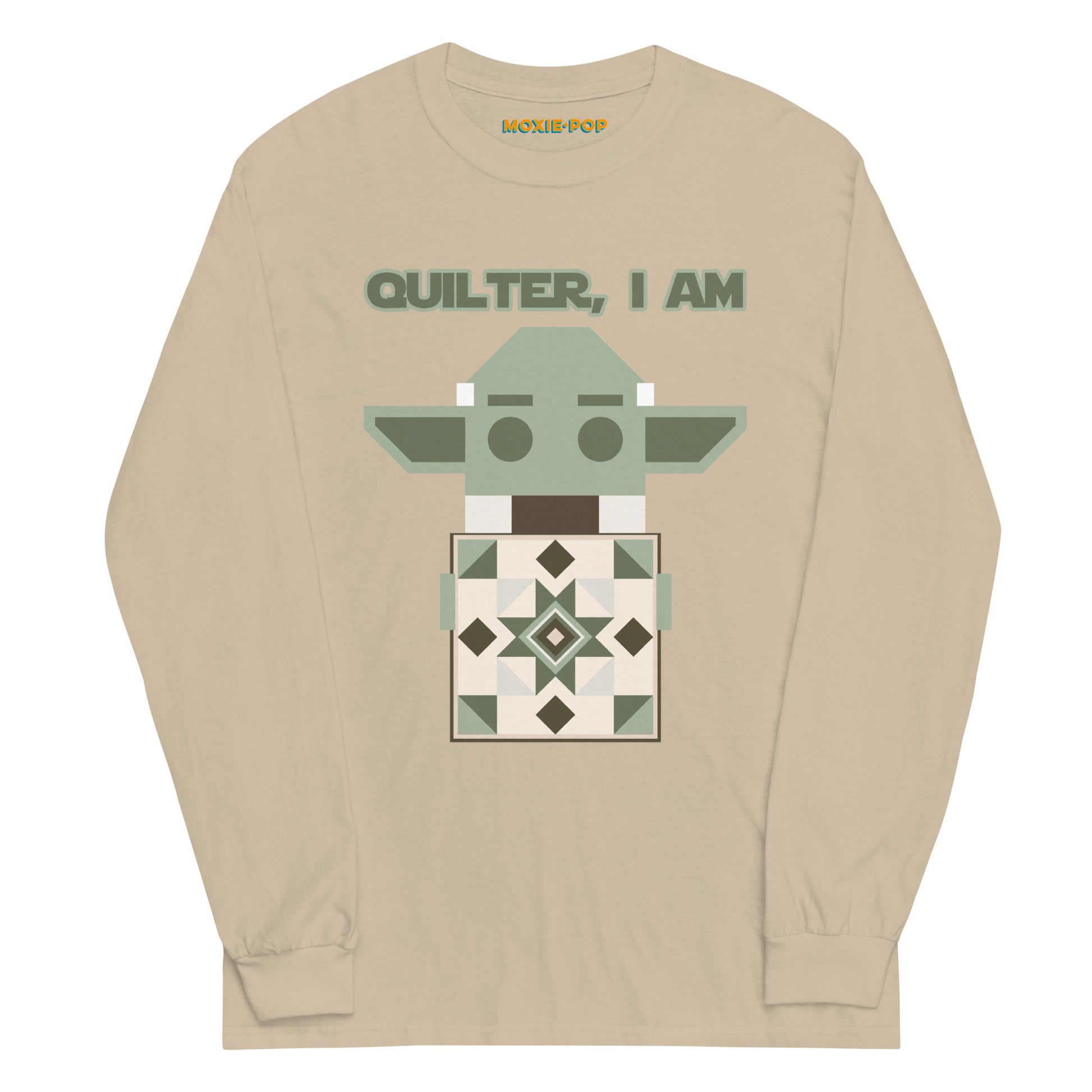 Lay flat product image of Moxie•Pop's men's long sleeve graphic tee with a geometric Yoda holding a quilt with the phrase "Quilter, I am" design in sand