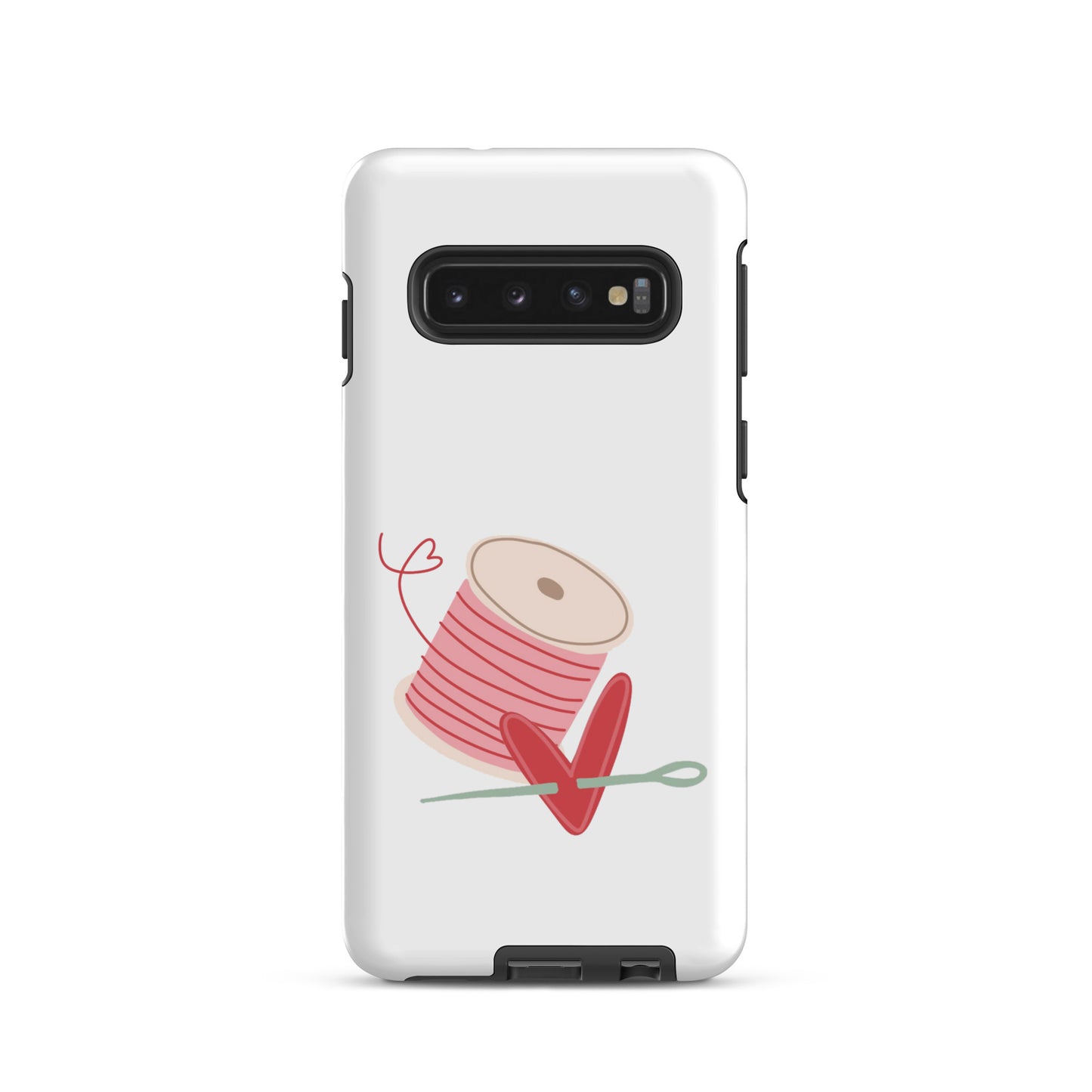 Product image of Moxie•Pop's tough case for Samsung® with a hand-drawn spool of pink thread and a heart pierced by a needle on a Galaxy S10