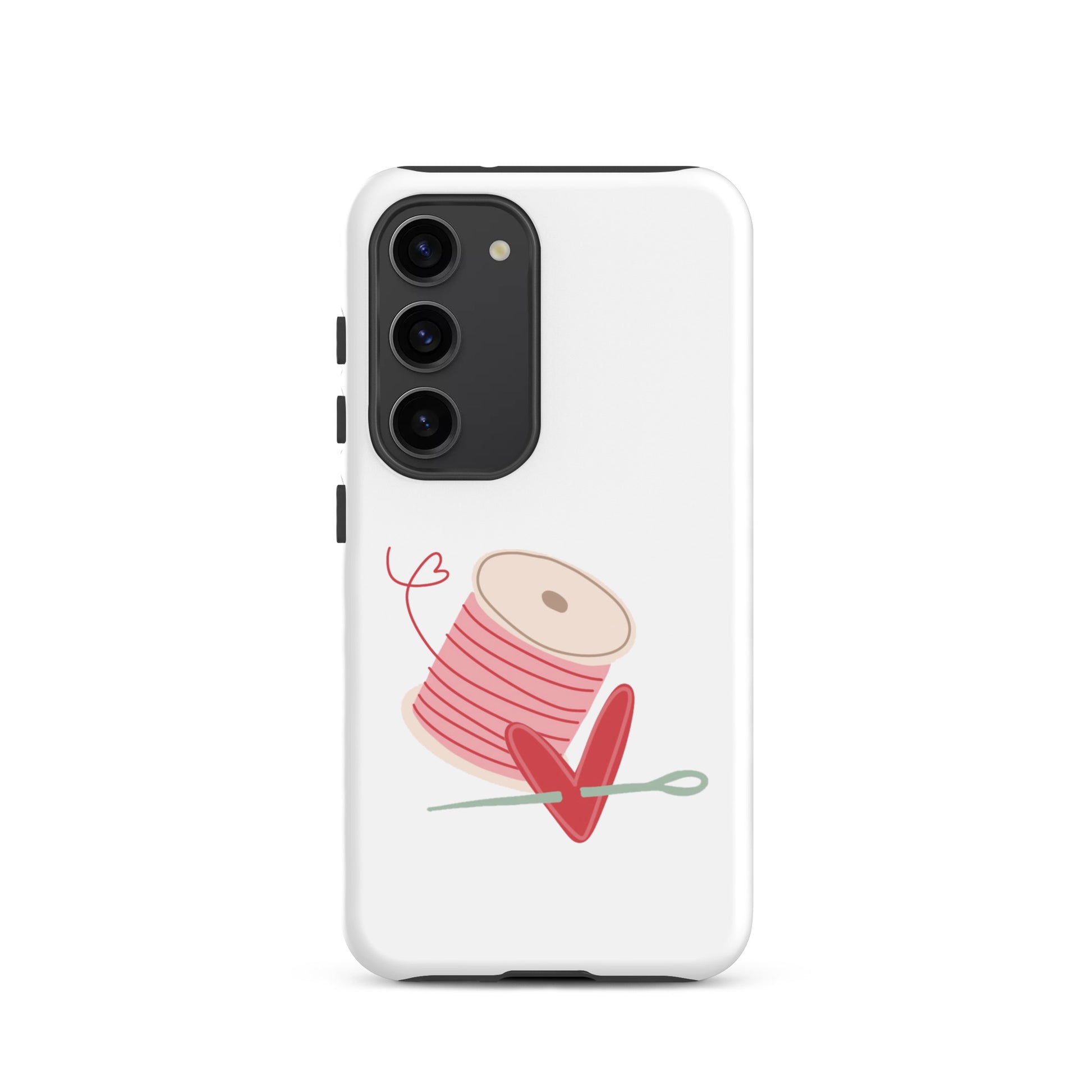 Product image of Moxie•Pop's tough case for Samsung® with a hand-drawn spool of pink thread and a heart pierced by a needle on a Galaxy S23