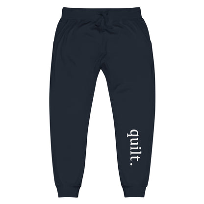 Moxie•Pop's unisex fleece jogger sweatpants with "quilt." on the front left shin in navy