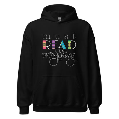 Ghost product image of Moxie•Pop's unisex graphic hoodie with 'Must Read Everything' with the downstroke of the word READ is created with hand drawn book spines in black. 