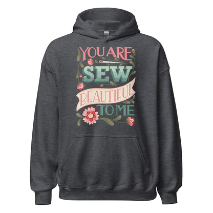 Ghost product image of Moxie•Pop's unisex graphic hoodie with "You are Sew Beautiful to me" with flowers in shades of pink in dark heather