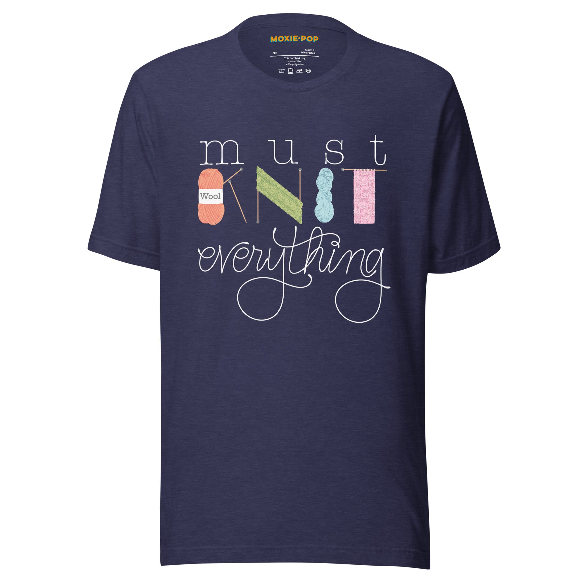 Ghost product image of Moxie•Pop's unisex graphic tee with hand lettered 'Must Knit Everything' with the word knit created from illustrations of yarn, needles, and knitting in heather midnight navy