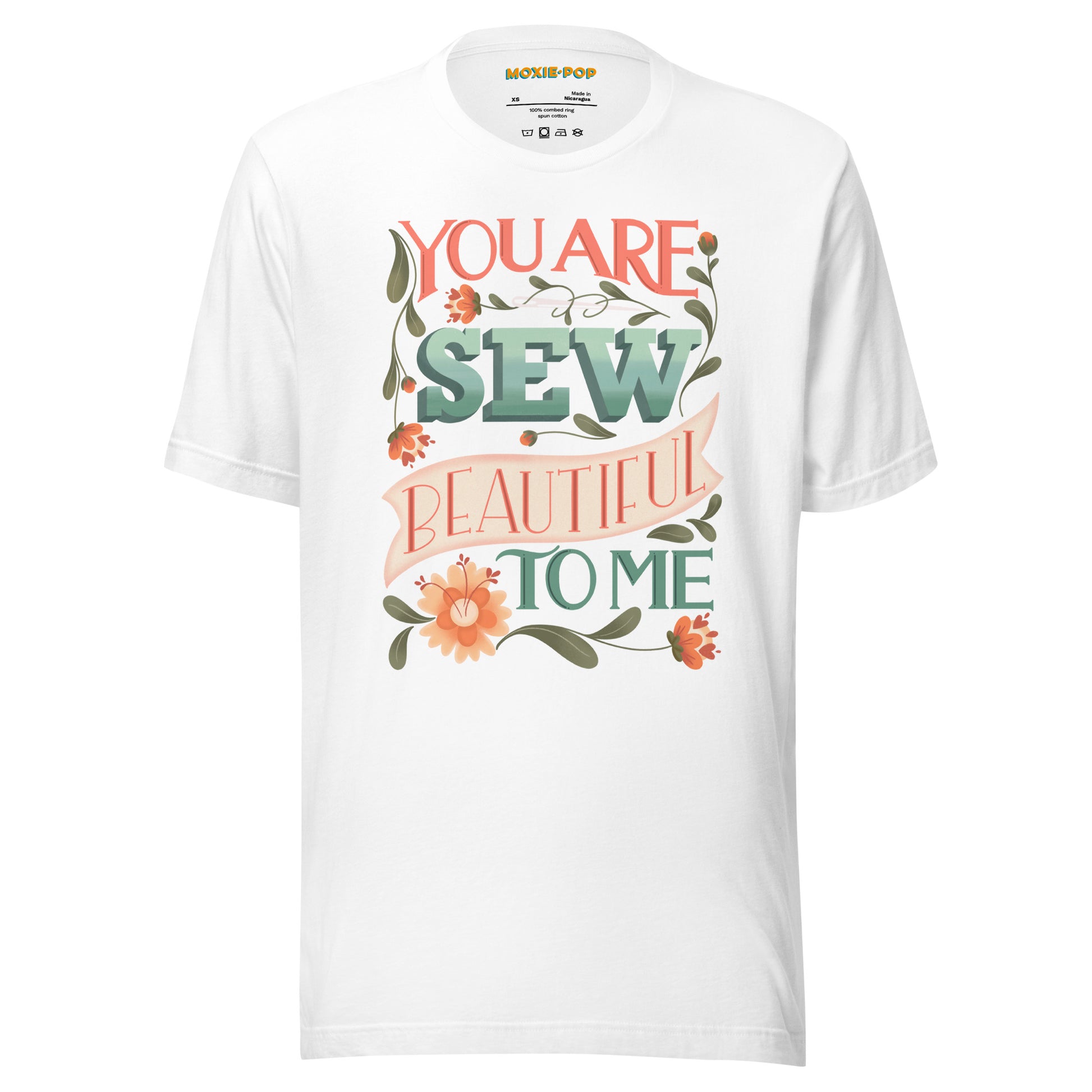 Ghost product image of Moxie•Pop's unisex graphic tee with "You are Sew Beautiful to me" in peach with flowers in white