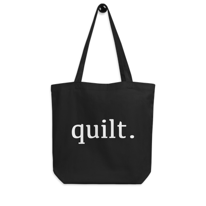 Moxie•Pop's eco graphic tote bag with 'quilt.' design product image hanging in black