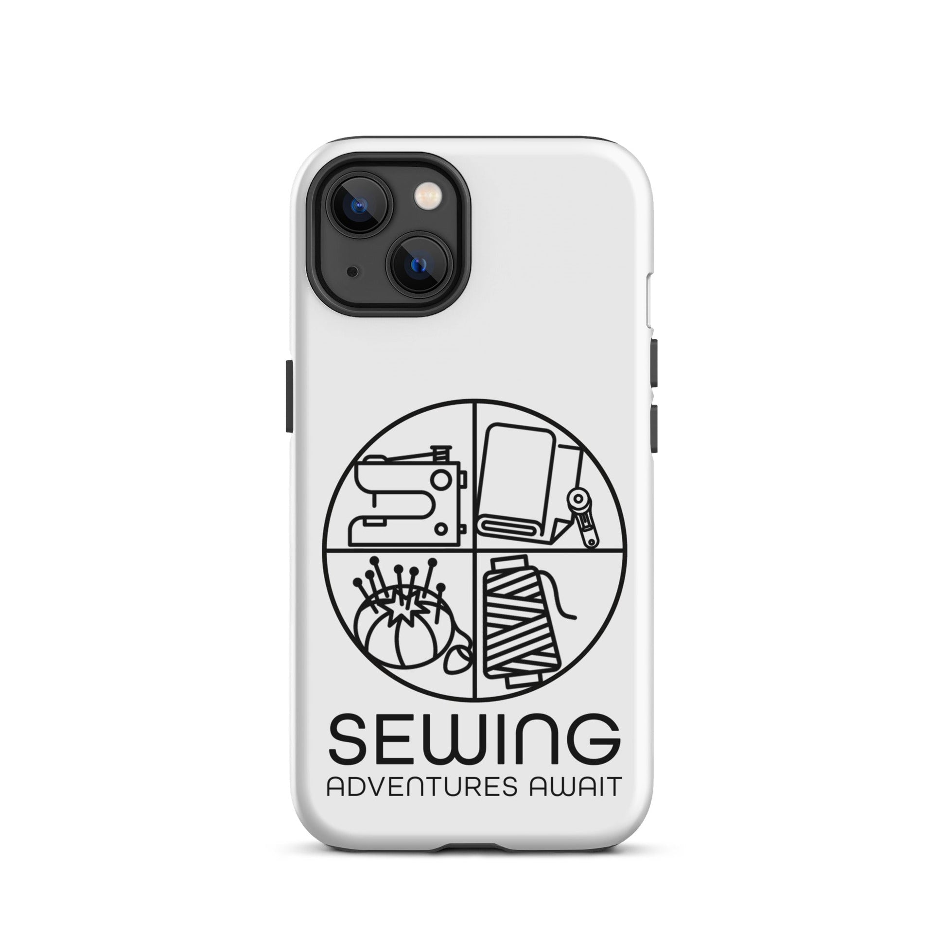 Moxie•Pop's tough case on a iPhone® in white with a black image of a circle in four quadrants each with a sewing tool icon above 'Sewing Adventures Await'. 