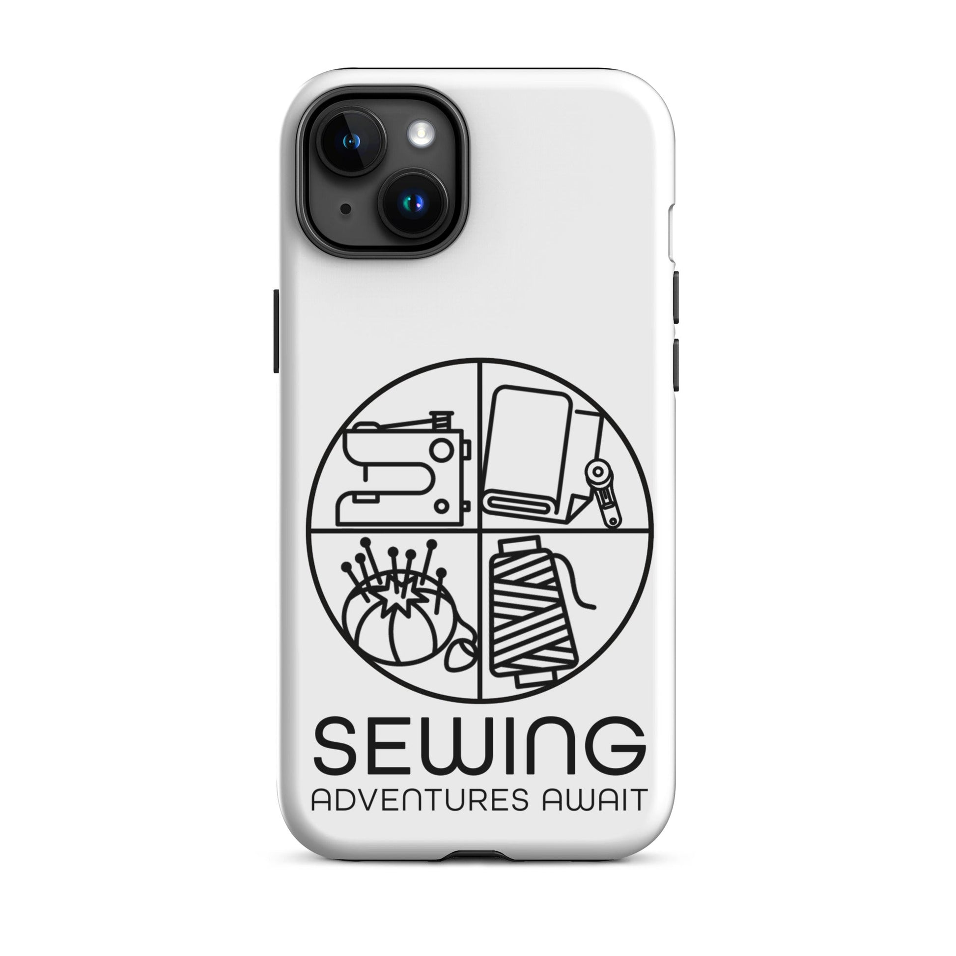 Moxie•Pop's tough case on a iPhone® in white with a black image of a circle in four quadrants each with a sewing tool icon above 'Sewing Adventures Await'. 