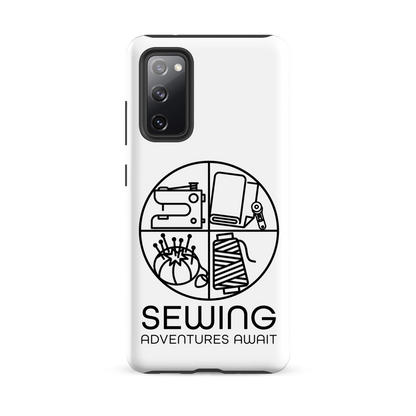 Moxie•Pop's tough case on a Samsung® in white with a black image of a circle in four quadrants each with a sewing tool icon above 'Sewing Adventures Await'. 