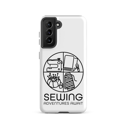 Moxie•Pop's tough case on a Samsung® in white with a black image of a circle in four quadrants each with a sewing tool icon above 'Sewing Adventures Await'. 