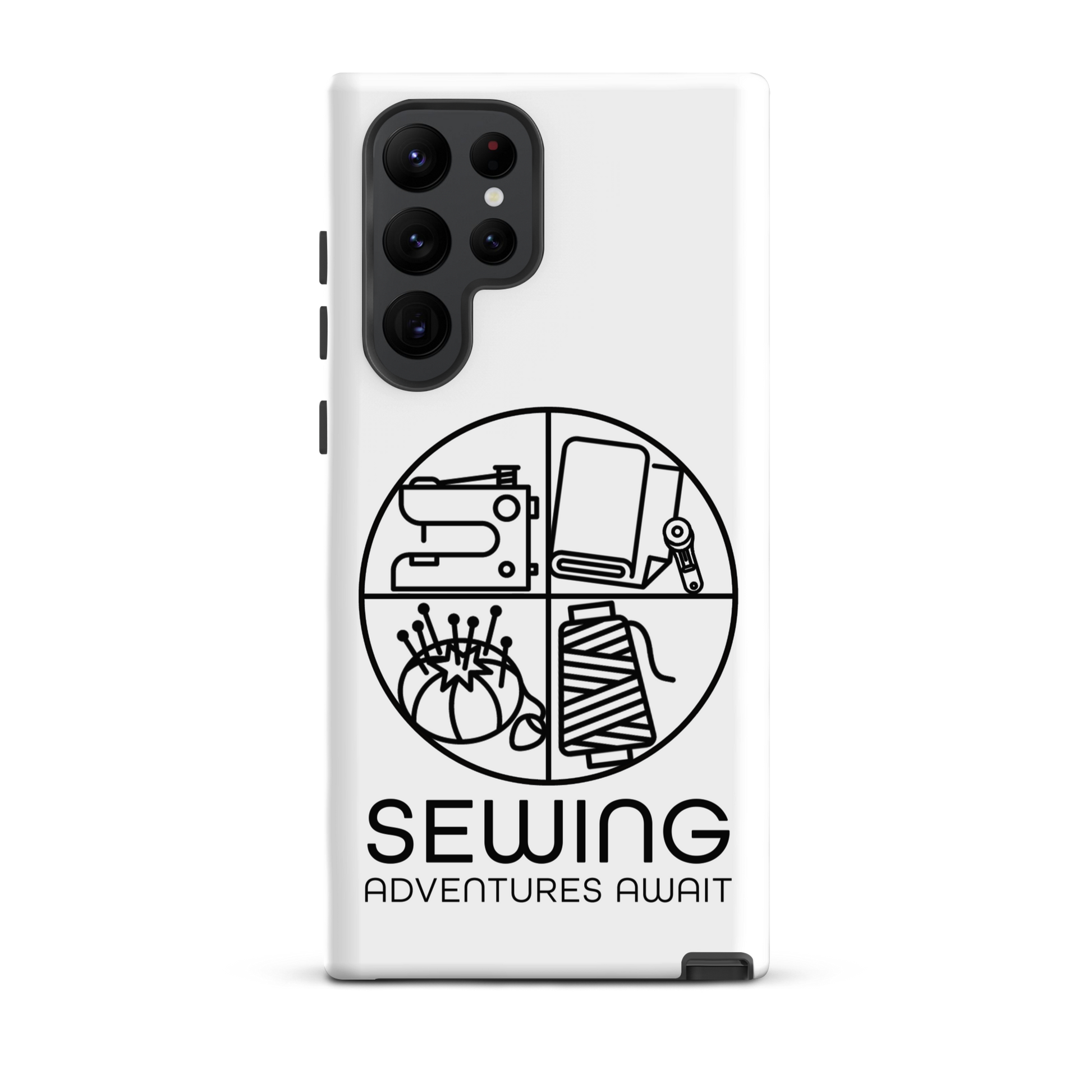 Moxie•Pop's tough case on a Samsung® in white with a black image of a circle in four quadrants each with a sewing tool icon above 'Sewing Adventures Await'. 