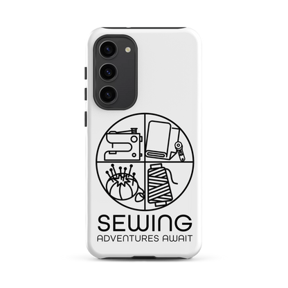 Moxie•Pop's tough case on a Samsung® in white with a black image of a circle in four quadrants each with a sewing tool icon above 'Sewing Adventures Await'. 