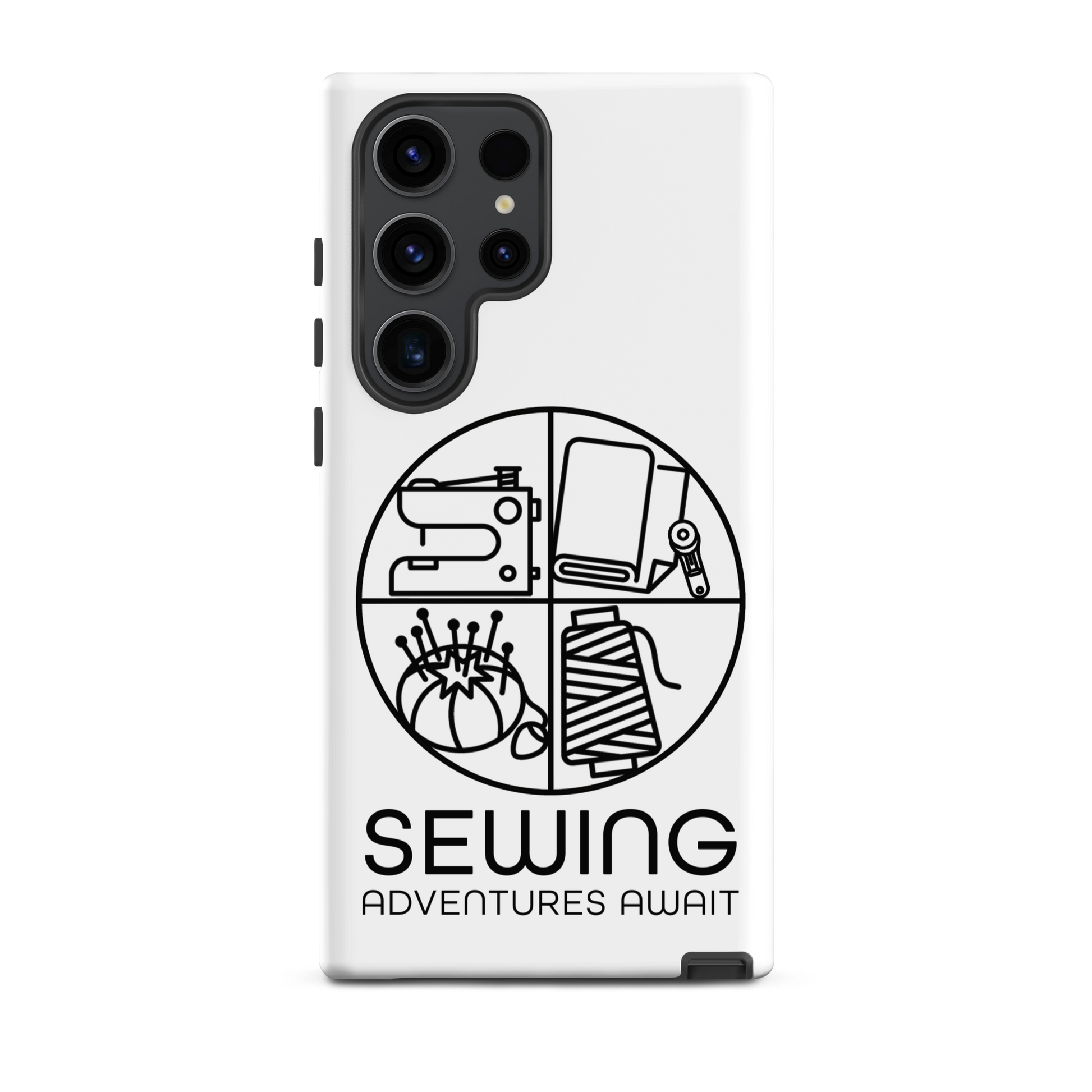 Moxie•Pop's tough case on a Samsung® in white with a black image of a circle in four quadrants each with a sewing tool icon above 'Sewing Adventures Await'. 